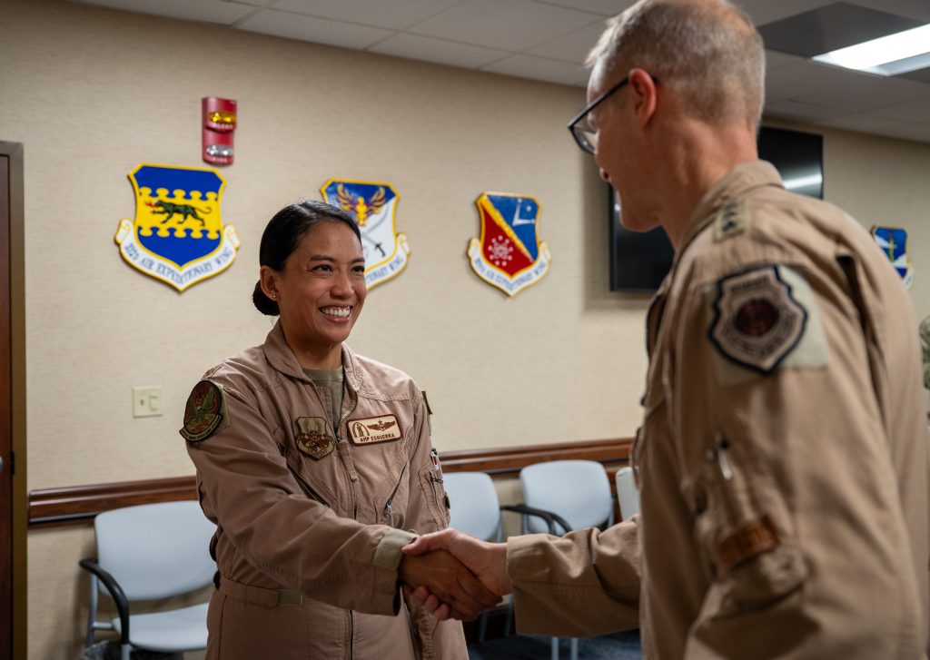 Esguerra shaking hands with officer
